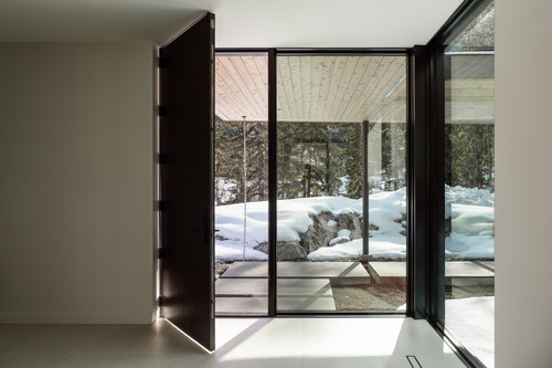 warbler residence whistler entry vestibule pivot door snow view.jpg