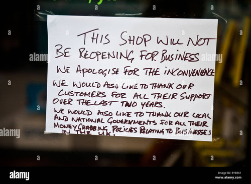 a handwritten protest notice sign in the window of a closed down shop BY8R61.jpg