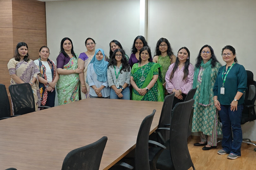 Empowered women united in a conference room.png