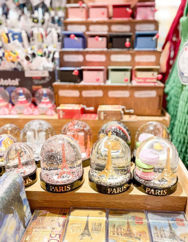 Snow globes in a souvenir shop in Paris scaled.jpg