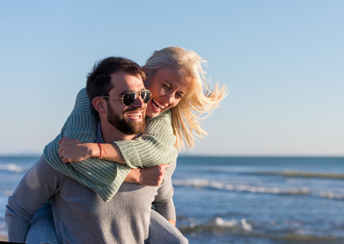 vecteezy couple having fun at beach during autumn 12646475.jpg