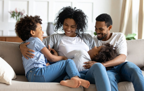 vecteezy joyful african american family relaxing on sofa sharing 70314743.jpg