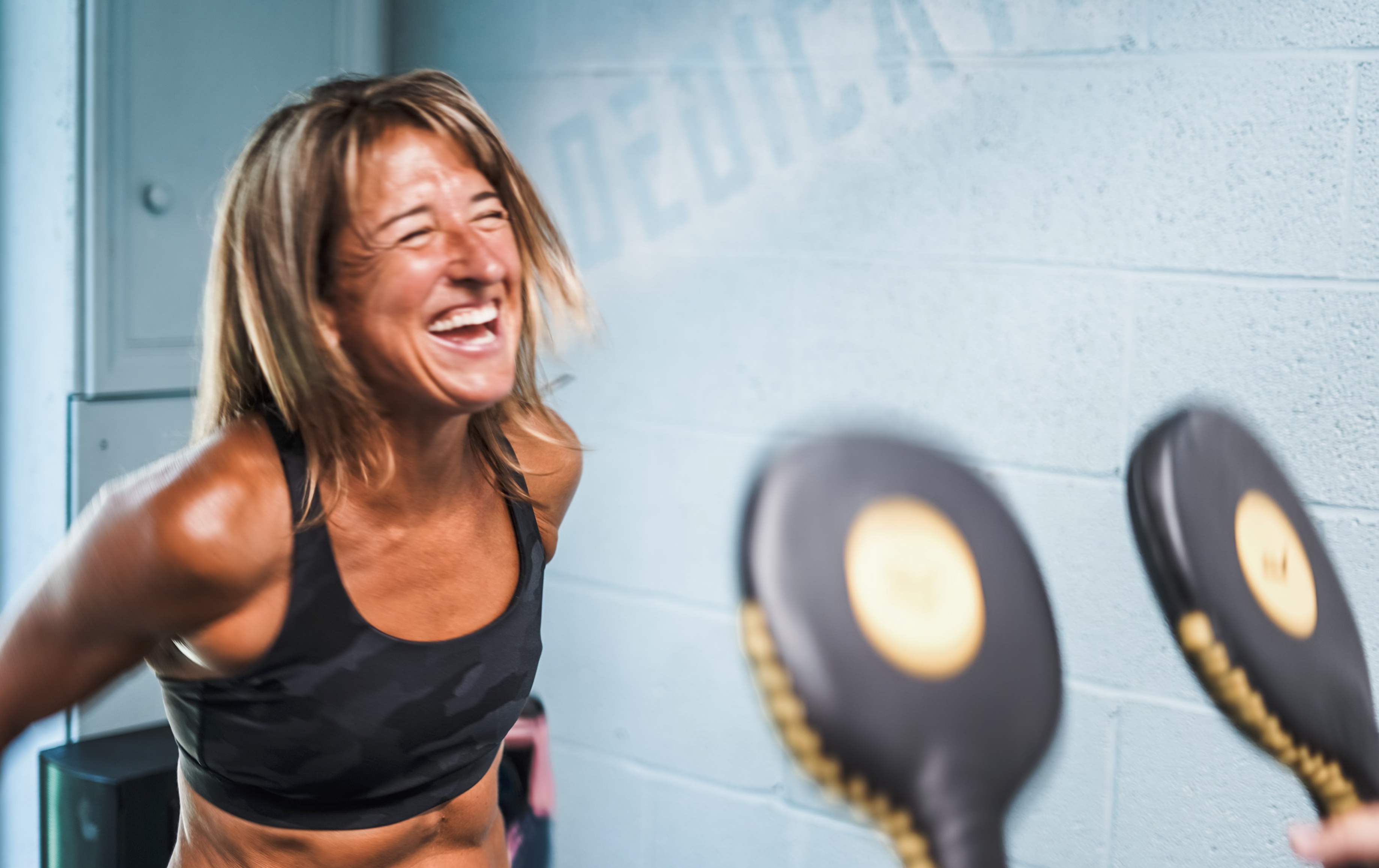 Kay Baker coaching boxing inspired conditioning at Love Life Fitness Studio