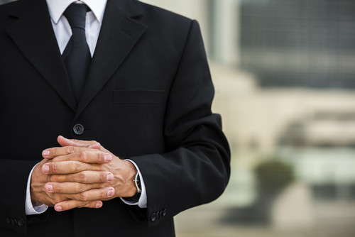 businessman with hands clasped.jpg