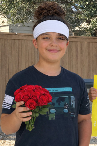 Confident smile and vibrant roses.jpg