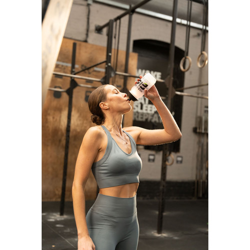 li woman drinking h24 creatine at gym.jpg