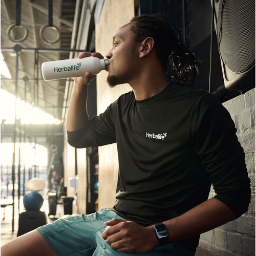 fi man drinking beverage gym.jpg