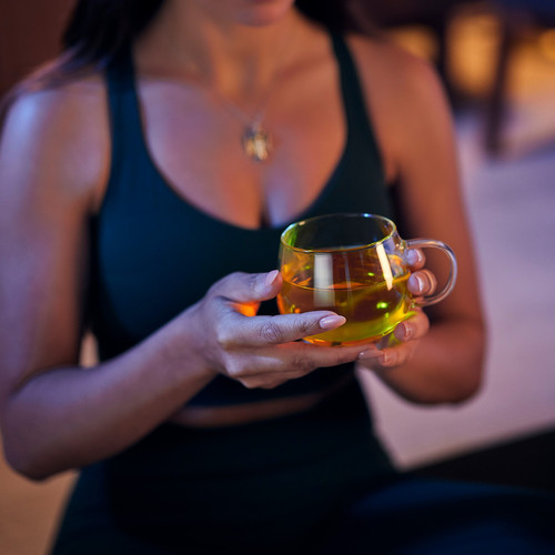 li woman holding tea night.jpg