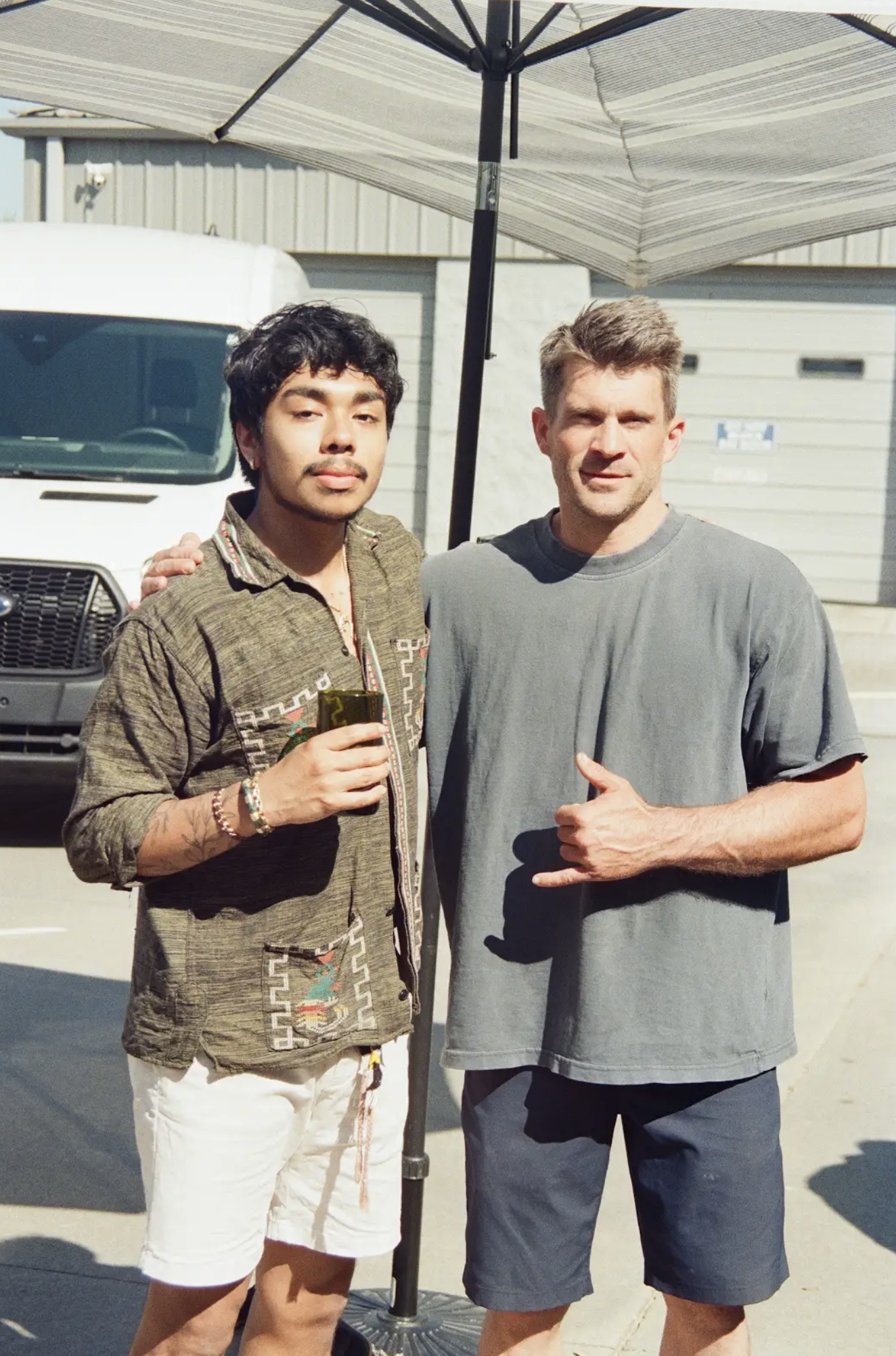 Isaac with Sean Herman, owner of Musou Movement, outside the Greenville movement studio