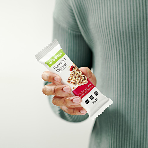 li man holding cranberry express bar.jpg