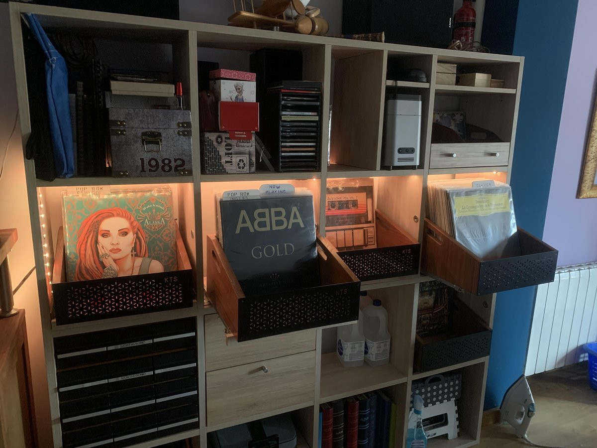 Turntable RPM setup closeup with vinyl collection