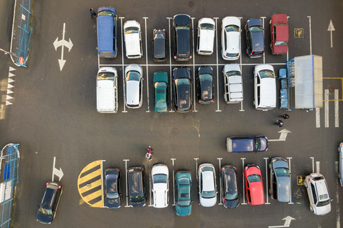 Top view of many cars parked on a parking lot..jpg