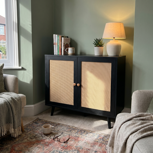 Our black rattan sideboard works in the chapel conservatory.png
