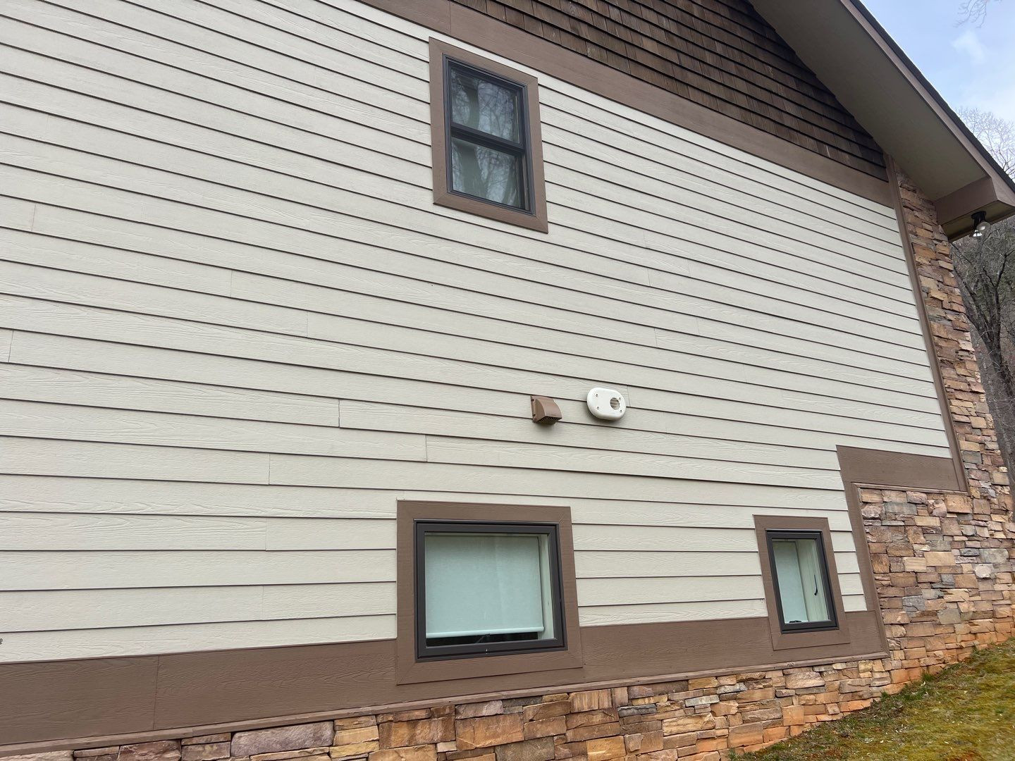 Professional window cleaning showing streak-free results on a home in North Georgia