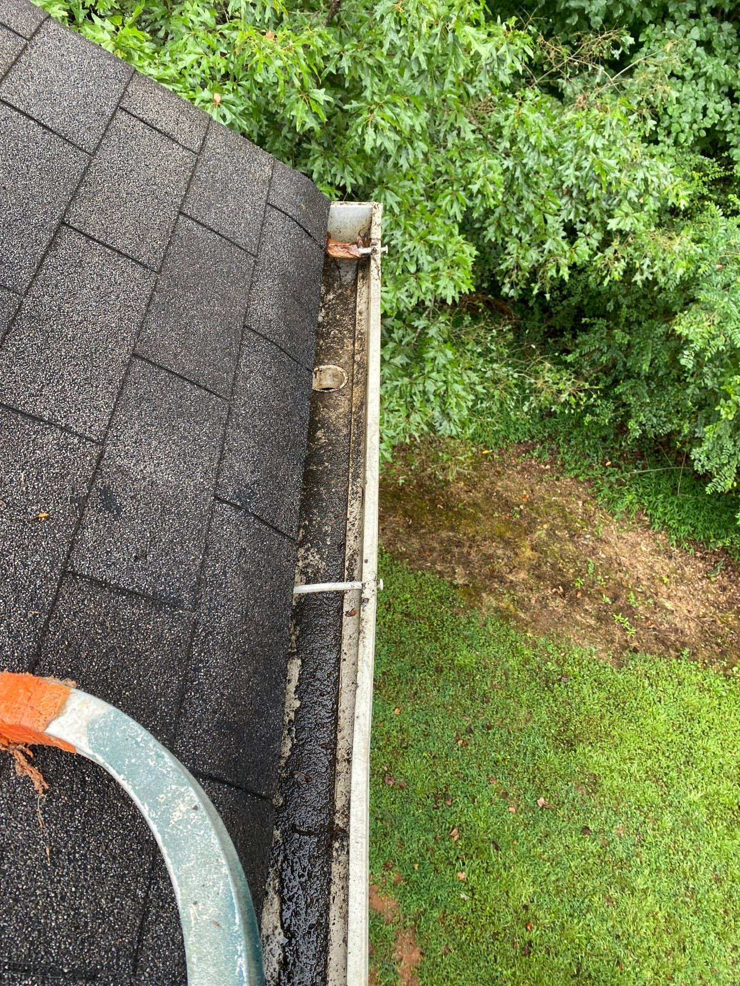 Clean gutter run and downspout after flushing on a residential property near Lake Hartwell Georgia