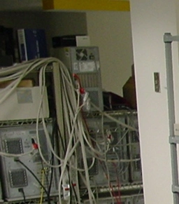 A picture of a bunch of servers surrounded by wires