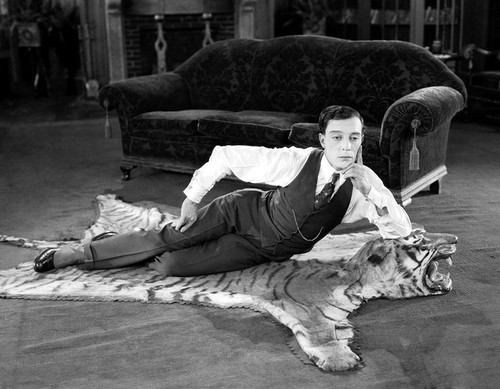 1924: American comedian Buster Keaton (1895-1966) lying on a tigerskin rug in his latest film 'The N.jpg