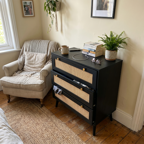 Rattan bedroom chest fits the space.png
