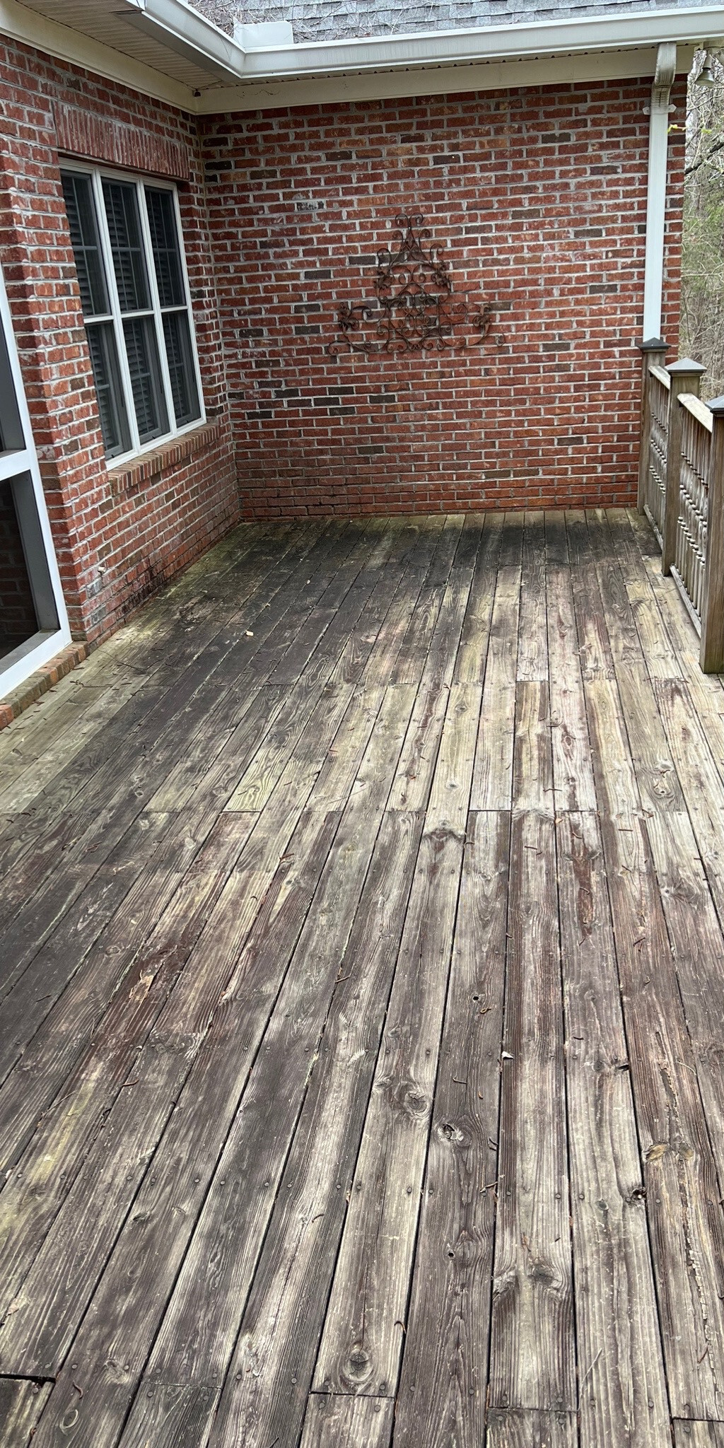 Weathered deck before pressure washing in Clarkesville Georgia