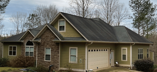 Roof with algae staining before soft wash treatment in Dahlonega Georgia