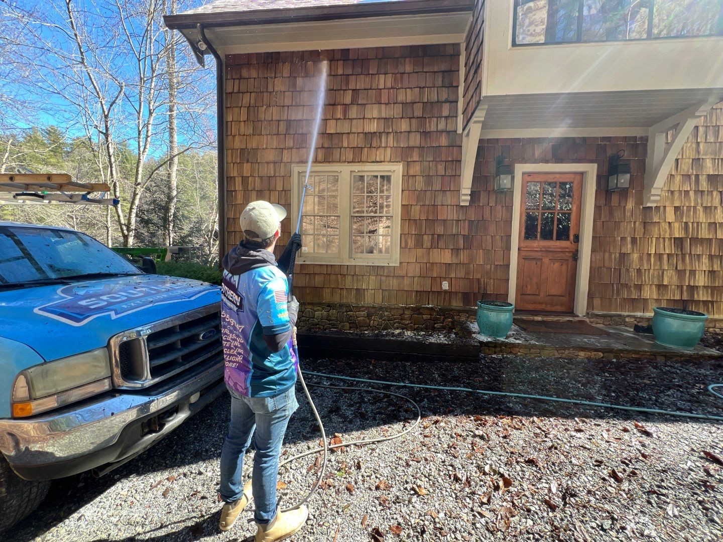 Southern Exterior Cleaning crew soft washing cedar shake siding on North Georgia home