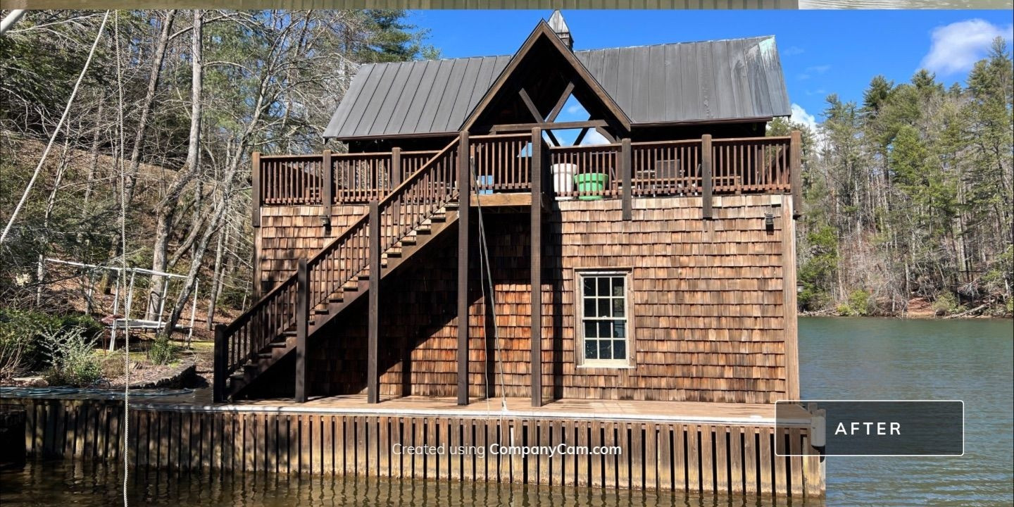 Cedar shake boathouse after professional soft wash cleaning showing restored natural wood color