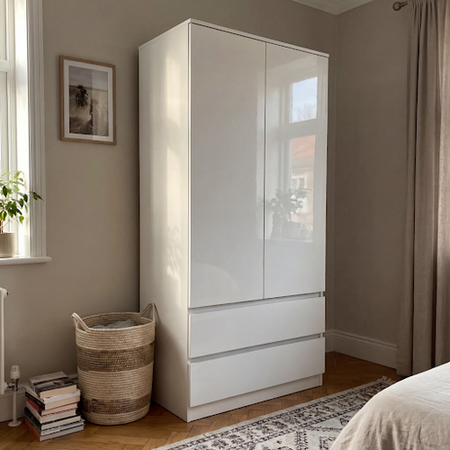 This white gloss wardrobe with drawers really brightens up my space.png