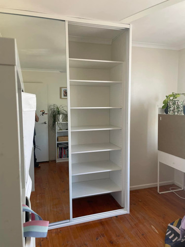 Sleek White Built-In Sliding Door Wardrobe for a Clean, Clutter-Free Contemporary Bedroom.jpg