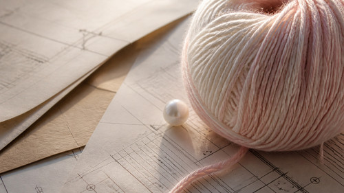 cream white crochet yarn on kraft paper.jpg