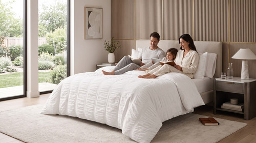 Family relaxing on bed watching 202607221901.jpg