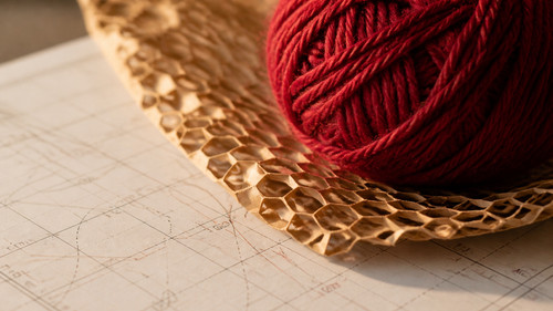 deep red crochet yarn on honeycomb wrapping mesh.jpg