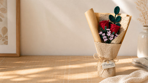 red crochet rose bouquet honeycomb wrapping on desk.jpg