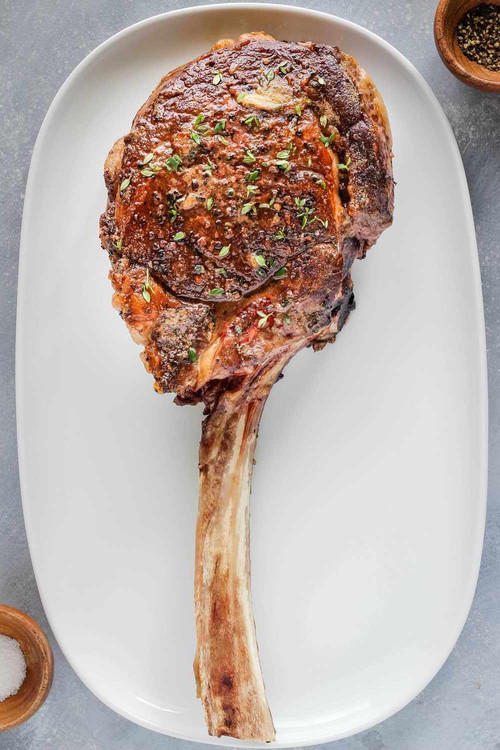 tomahawk rib eye steak 2313425 hero 01 98fc6c07472c440fbdfdd87db6c71e26.jpg