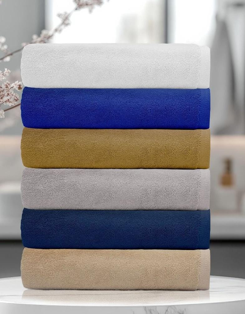 Stack of folded cotton bath towels for wholesale