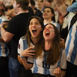 Argentina fans celebrate in a bar in Barcelona, Spain during the World Cup final soccer match betwee