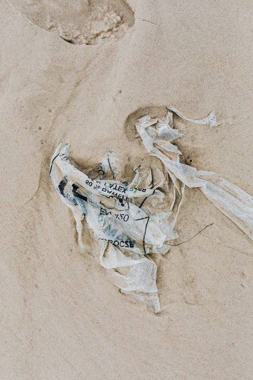 Plastic film waste washed up on a beach