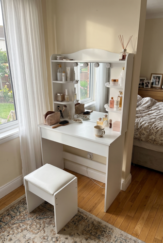 Dressing table with drawers and side shelving for makeup essentials.png