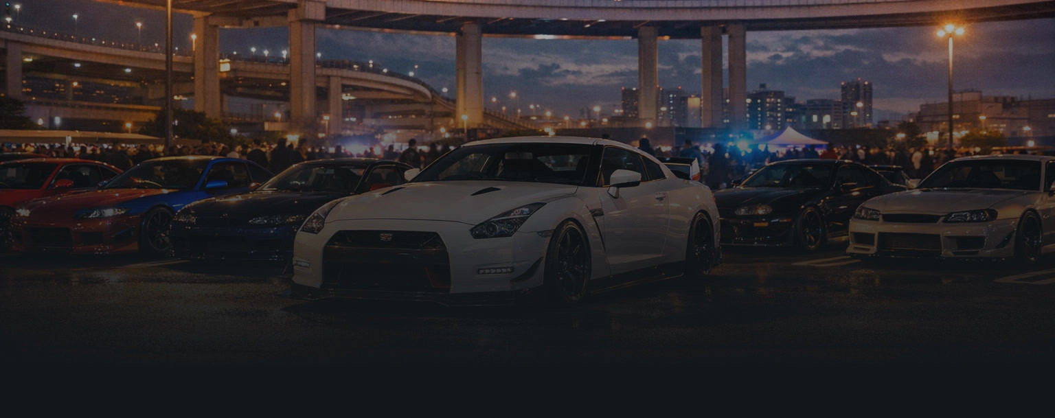 Daikoku Parking Area at night with tuned cars at a Japanese car meet