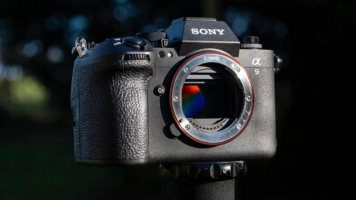 Sony A9 III camera outside with background foliage, no lens attached