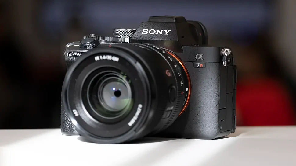 The Sony A7R V camera sitting on a white table