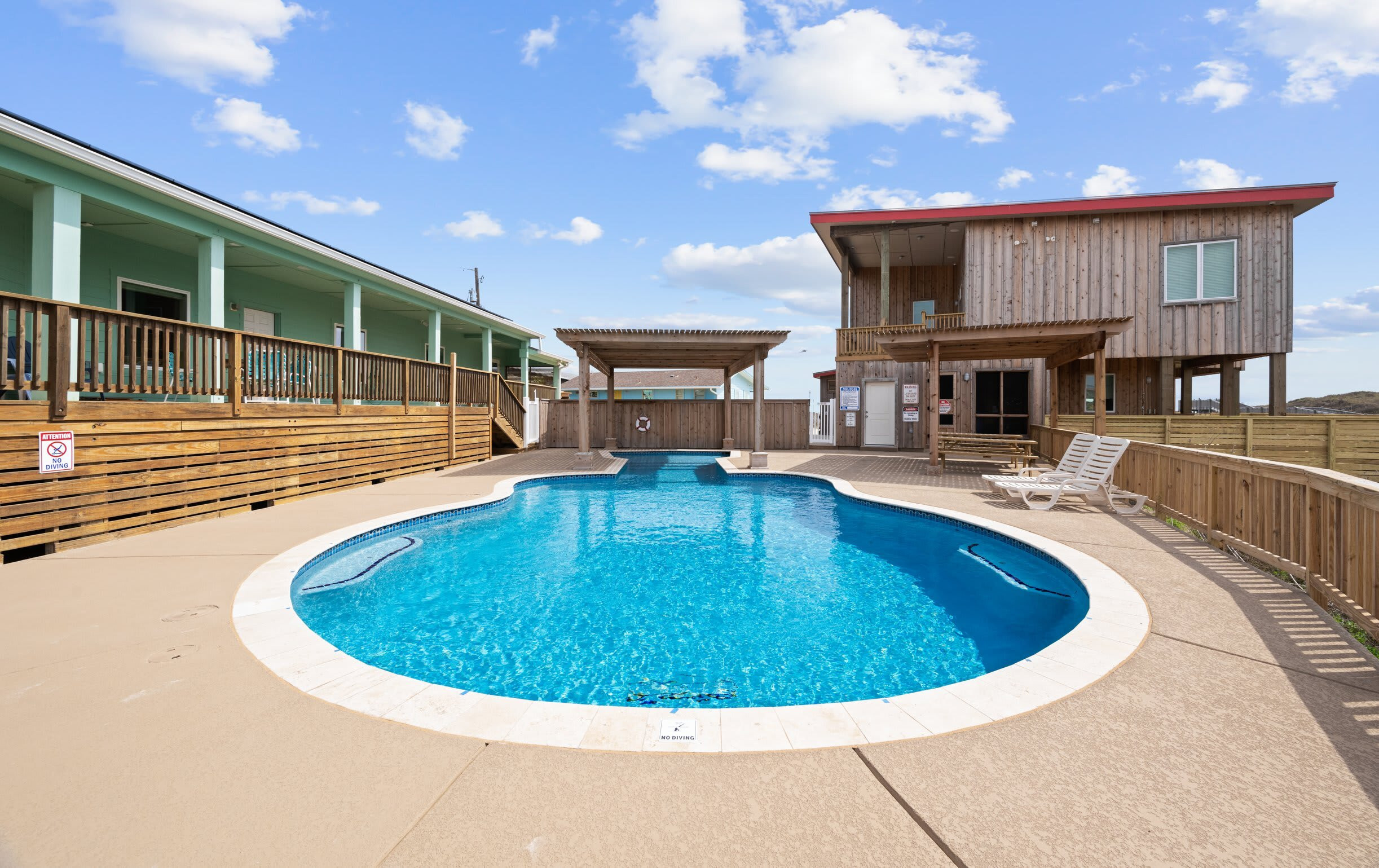 Private Pool — Freeform Pool Between Beach Houses with Pergola