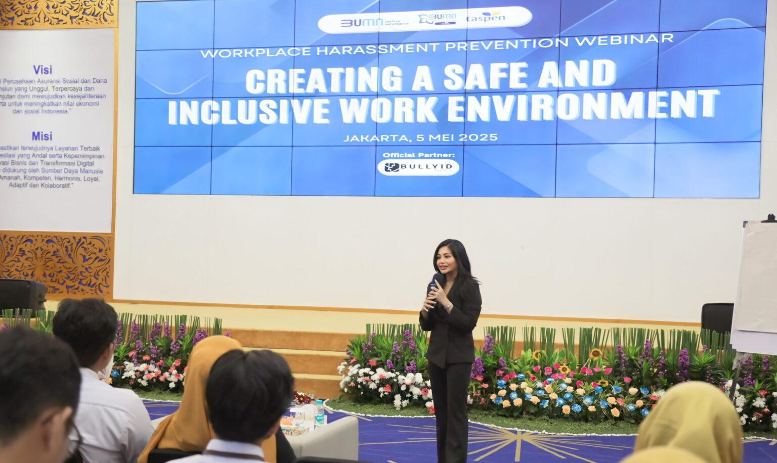 Professional woman presenting a safe and inclusive work environment webinar