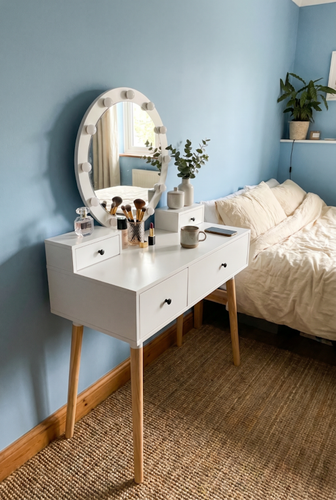 White dressing table with mirror styling for a bedroom corner.png