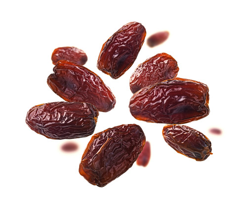 dried dates levitate white background.jpg