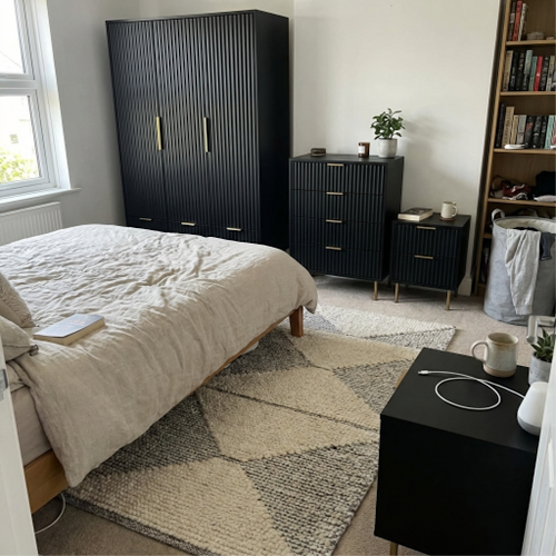 A Black 4 piece bedroom set from DHS That Makes a Statement.png