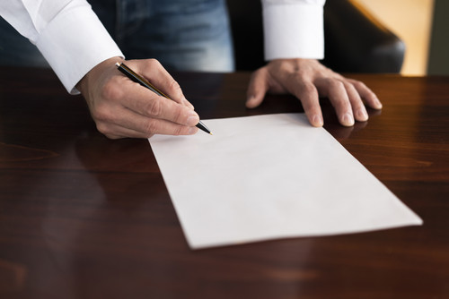 corporate employee writing blank paper.jpg