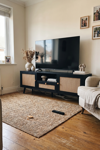 Rattan TV cabinet with centre drawer and cane doors.png