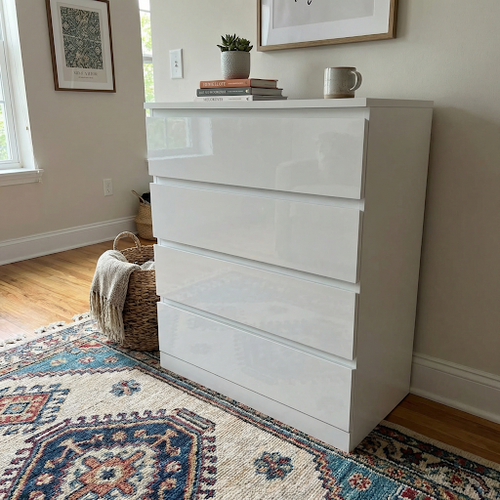 This white gloss chest looks brilliant in our room.png