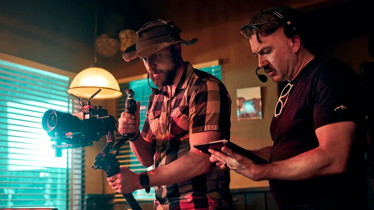 Videographer filming with a Sony FX5 on set