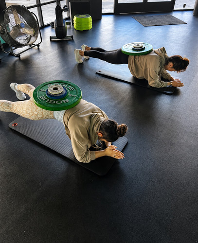 Weighted Plank Workout in a Bright Gym.jpg